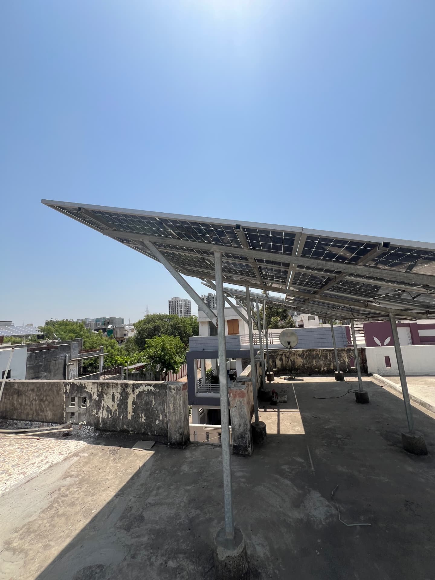 Elevated rooftop solar installation on a terrace